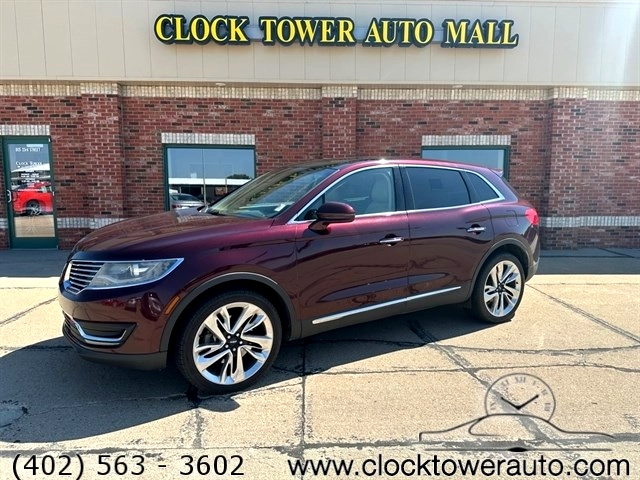 Affordable sedans lined up at local car dealership